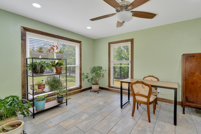 sitting room with a wealth of natural light and ceiling fan