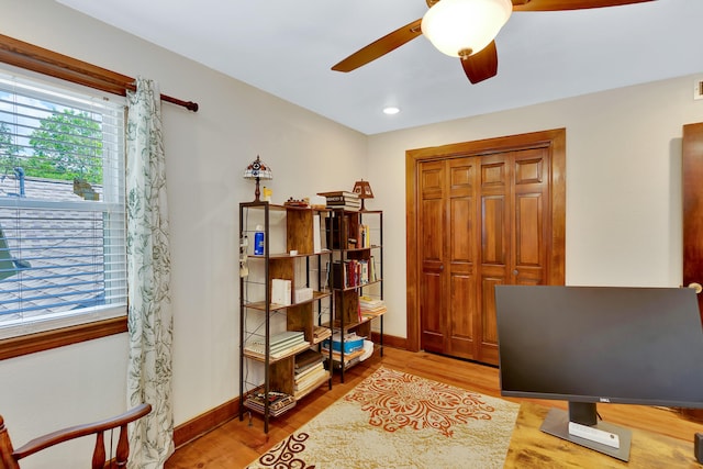 interior space featuring light wood-type flooring and ceiling fan