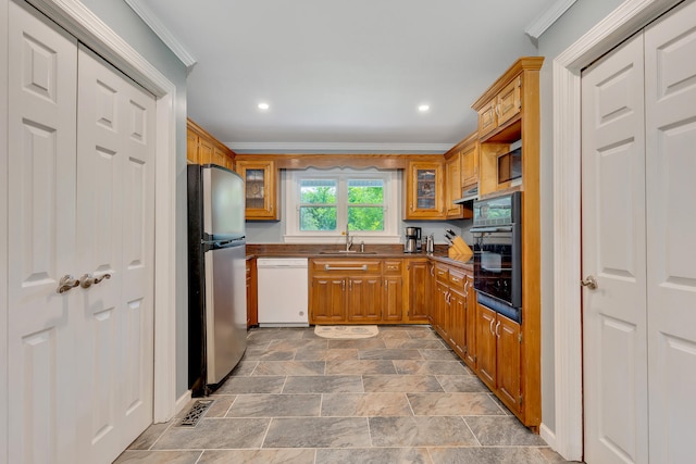 kitchen featuring dishwasher, crown molding, extractor fan, black oven, and stainless steel fridge