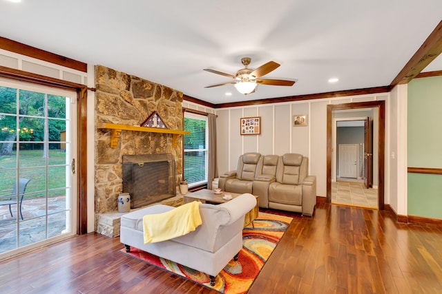 living room featuring a healthy amount of sunlight, ceiling fan, and hardwood / wood-style floors