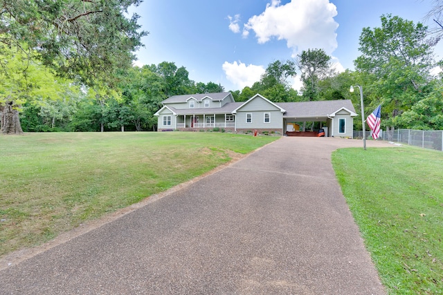 ranch-style home with a front yard and a carport