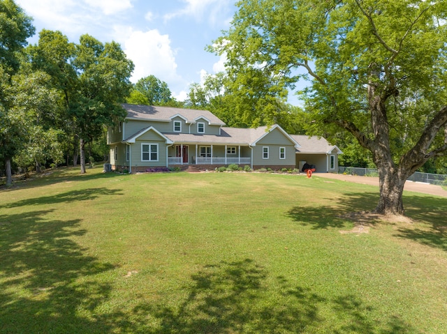 view of front of property with a front yard and covered porch