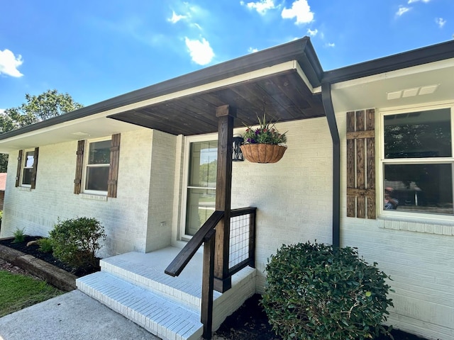 entrance to property featuring covered porch