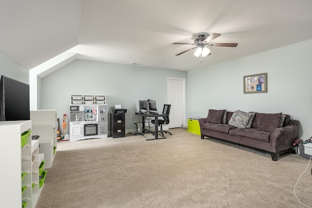 living room with vaulted ceiling, ceiling fan, and light colored carpet