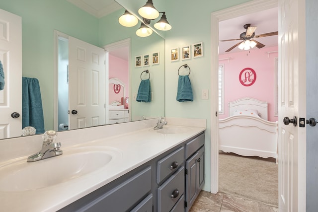 bathroom with ceiling fan, vanity, and crown molding