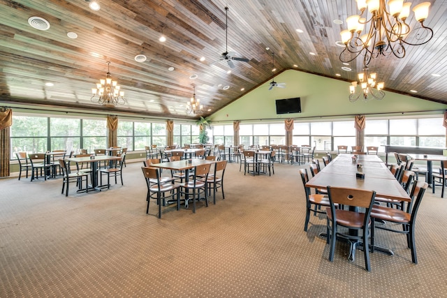 carpeted dining space with ceiling fan with notable chandelier, wood ceiling, and high vaulted ceiling