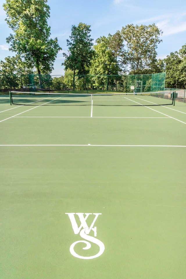 view of tennis court featuring basketball court