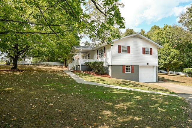 view of home's exterior featuring a lawn and a garage