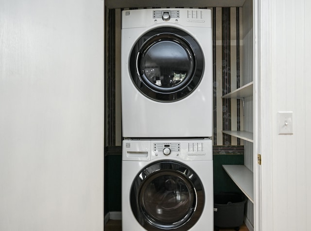 washroom featuring stacked washer and dryer