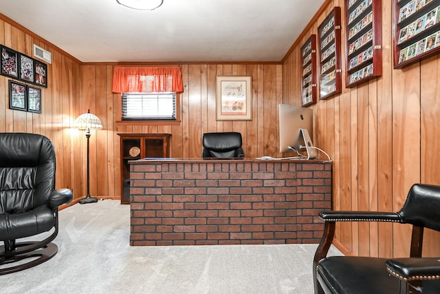 bar featuring wood walls, ornamental molding, and carpet