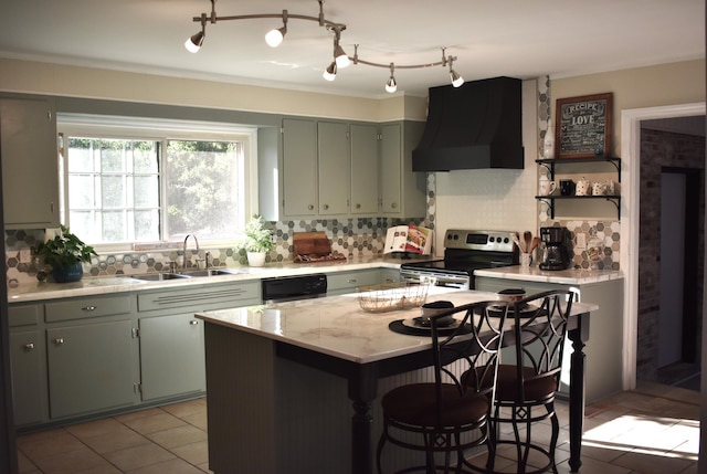 kitchen with premium range hood, sink, backsplash, a center island, and electric stove