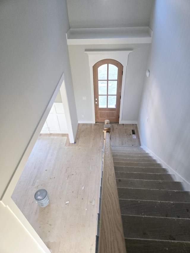 stairs with wood-type flooring