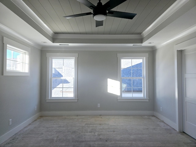 unfurnished room featuring ceiling fan, a tray ceiling, and wood ceiling