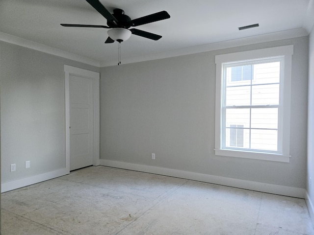 empty room featuring ceiling fan and ornamental molding