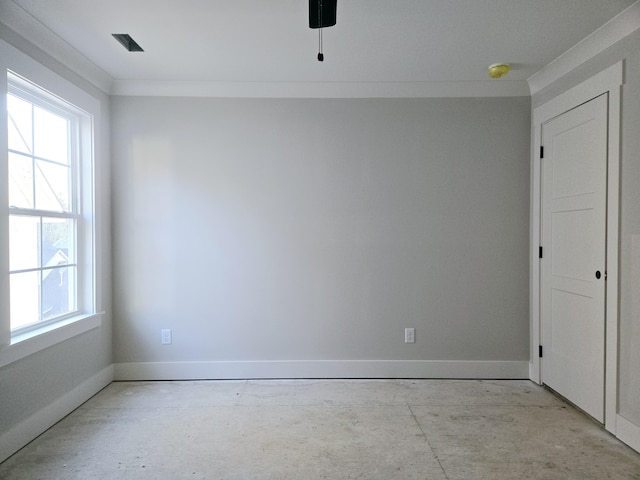 spare room with ceiling fan and crown molding