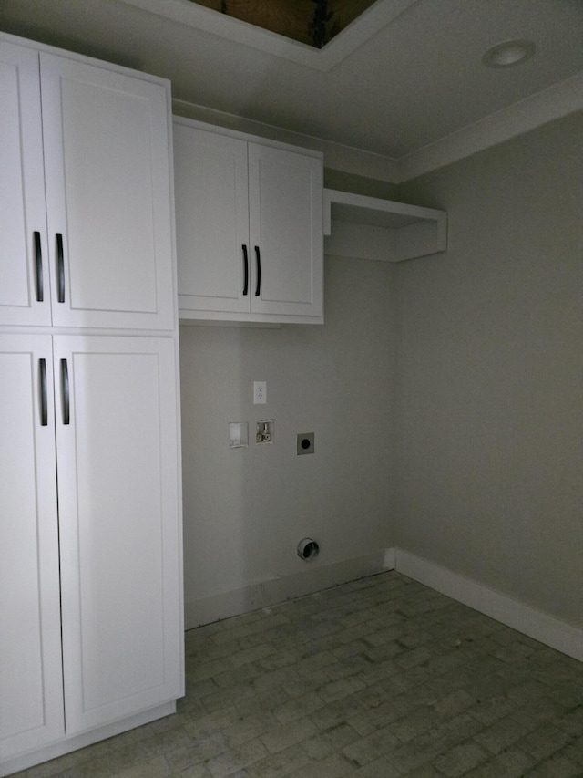 washroom featuring cabinets, hookup for an electric dryer, and hookup for a washing machine