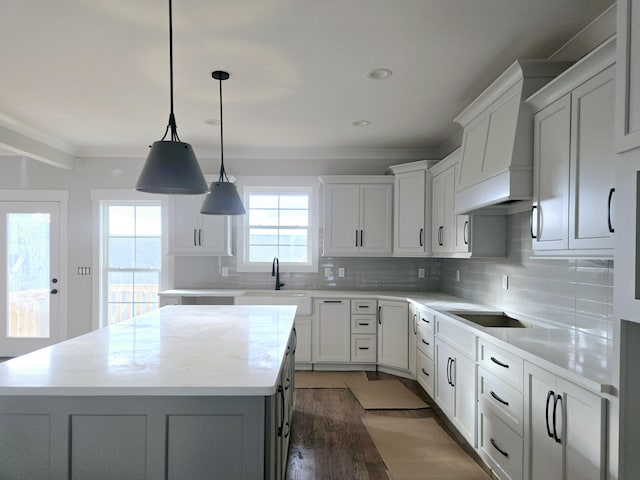 kitchen featuring white cabinetry, decorative light fixtures, black electric cooktop, and a kitchen island