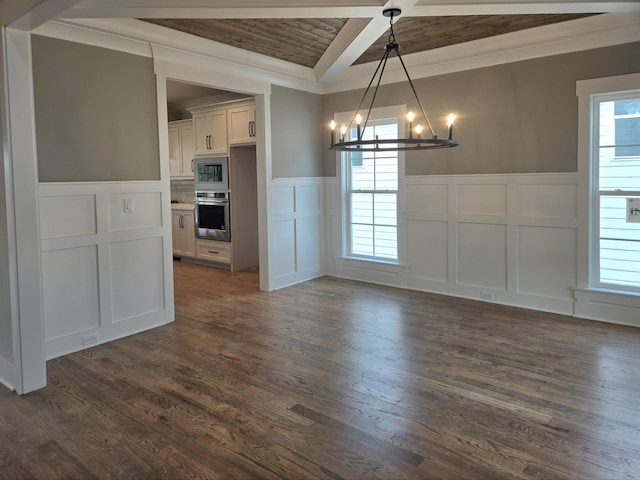 9885 Trestle Cir Unit 47, Ooltewah, TN 37363 - unfurnished dining area with a decorative wall, a chandelier, crown molding, a wainscoted wall, and dark wood-style flooring