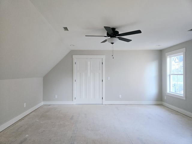 bonus room with lofted ceiling and ceiling fan