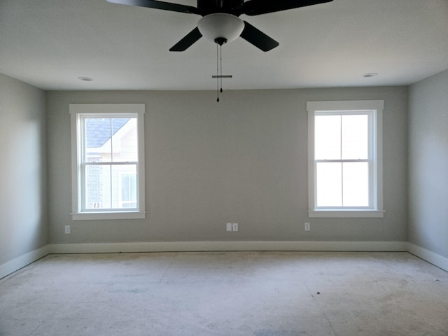 empty room featuring ceiling fan and a healthy amount of sunlight