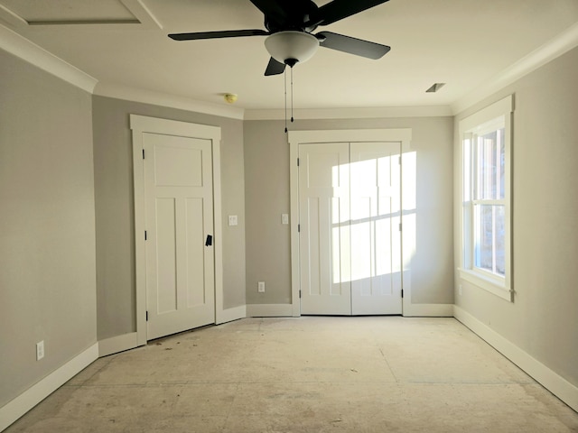 spare room with ceiling fan and ornamental molding