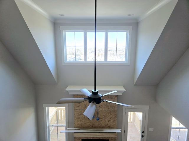 interior details with crown molding and ceiling fan