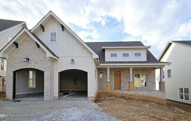 view of front of house with a garage and covered porch