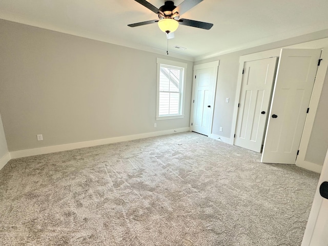 9877 Trestle Cir Unit 46, Ooltewah, TN 37363 - unfurnished bedroom with multiple closets, baseboards, and carpet