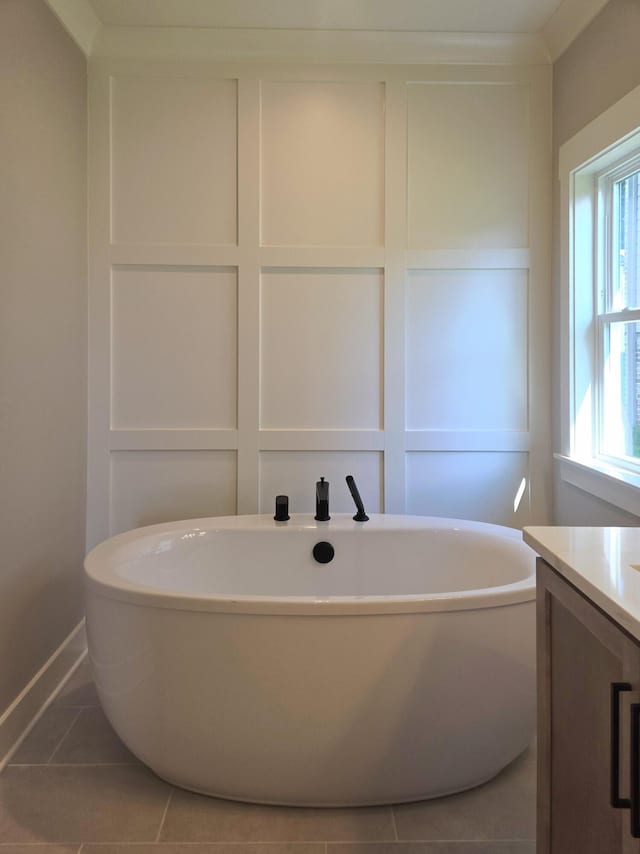 9877 Trestle Cir Unit 46, Ooltewah, TN 37363 - bathroom featuring a freestanding bath, vanity, and tile patterned floors