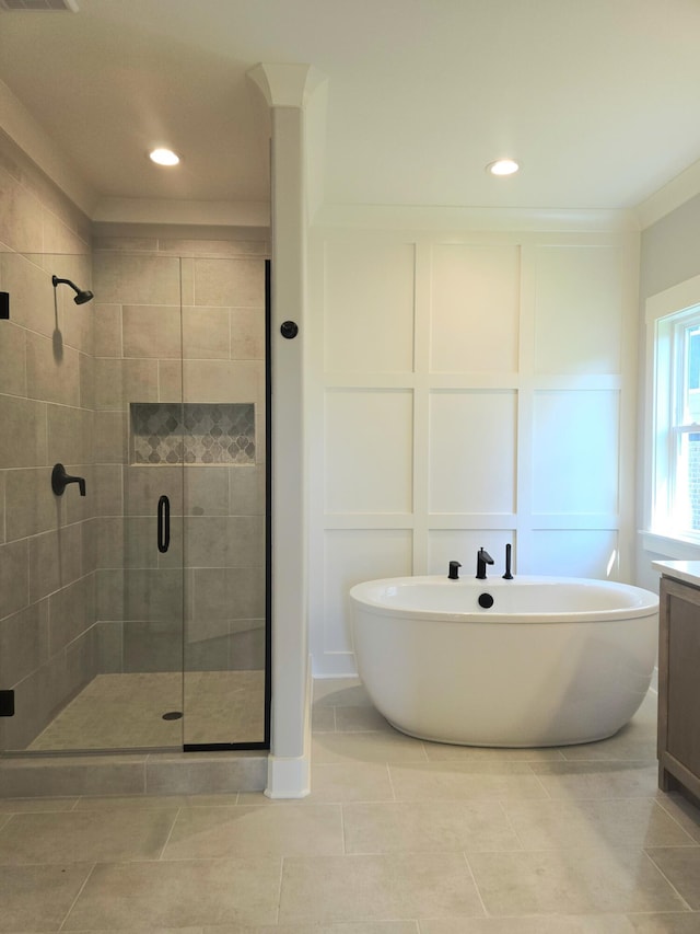 9877 Trestle Cir Unit 46, Ooltewah, TN 37363 - bathroom featuring a shower stall, a soaking tub, tile patterned flooring, recessed lighting, and vanity