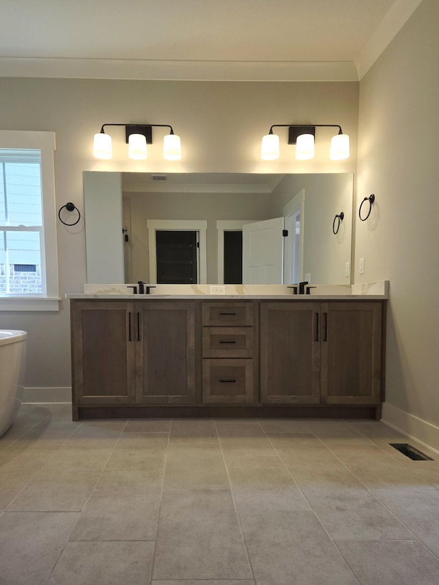 9877 Trestle Cir Unit 46, Ooltewah, TN 37363 - bathroom with double vanity, crown molding, tile patterned flooring, and a freestanding tub