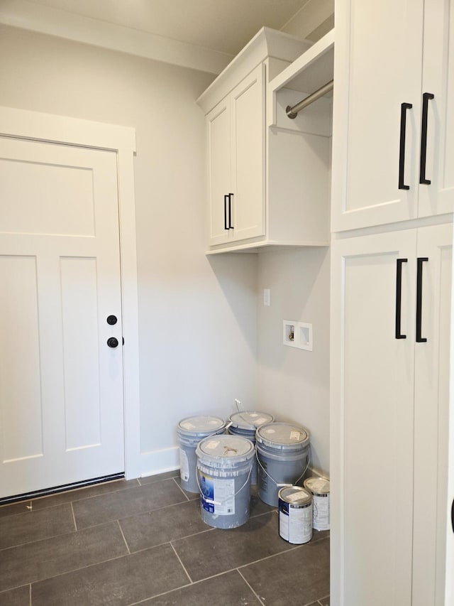 9877 Trestle Cir Unit 46, Ooltewah, TN 37363 - washroom with hookup for a washing machine, dark tile patterned floors, and cabinet space