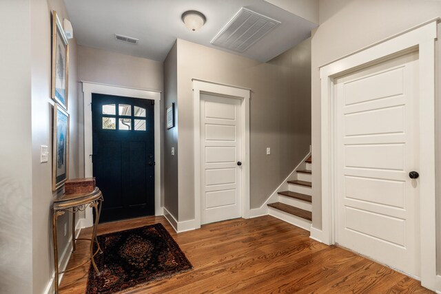 entrance foyer featuring dark hardwood / wood-style floors