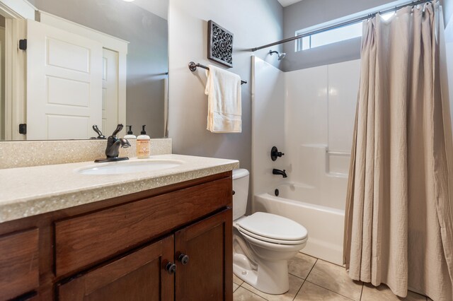 full bathroom featuring toilet, vanity, shower / bathtub combination with curtain, and tile patterned flooring