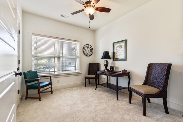 sitting room with light carpet and ceiling fan