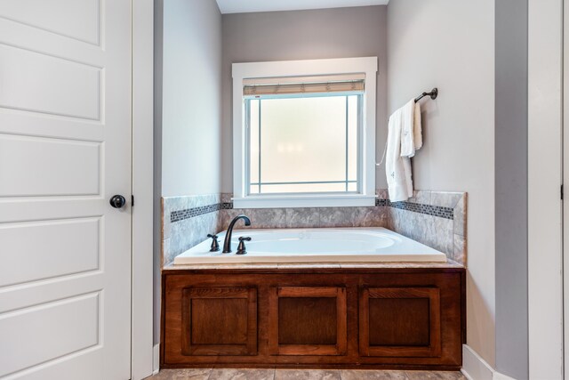 bathroom with a tub to relax in