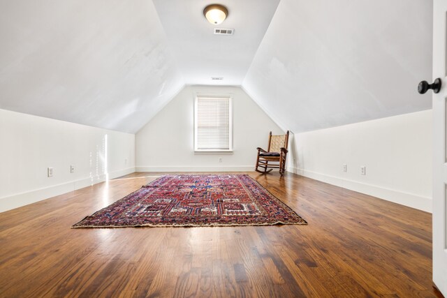 bonus room featuring lofted ceiling and hardwood / wood-style floors