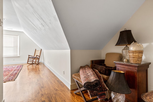 office area featuring vaulted ceiling and light hardwood / wood-style floors