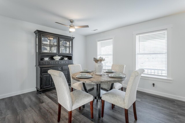 dining space featuring dark hardwood / wood-style flooring and ceiling fan