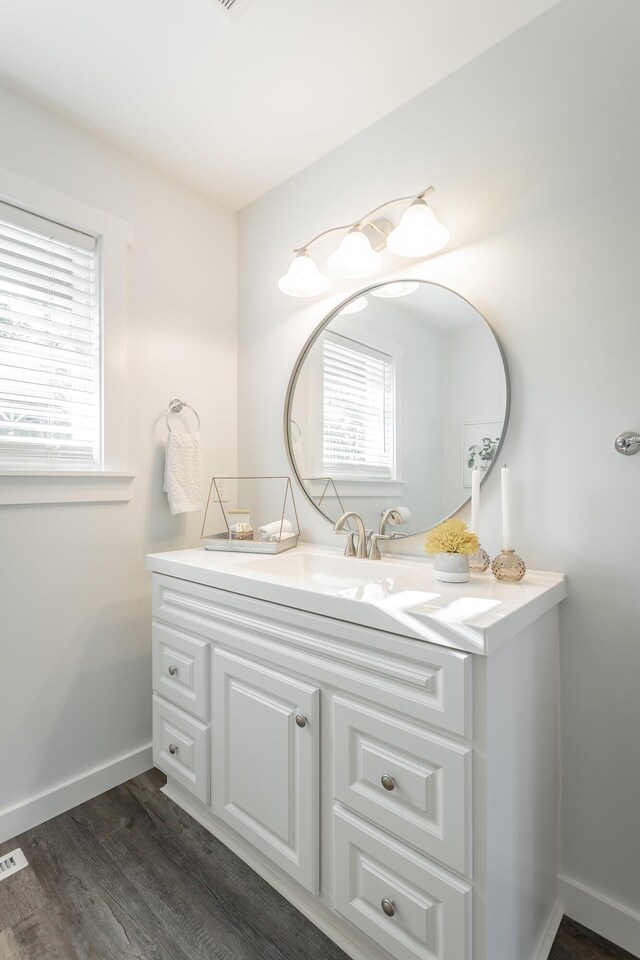 bathroom featuring wood-type flooring and vanity