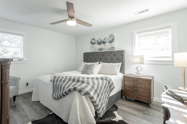 bedroom with ceiling fan and hardwood / wood-style floors