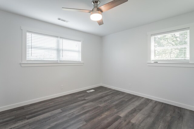 empty room featuring dark hardwood / wood-style floors and ceiling fan