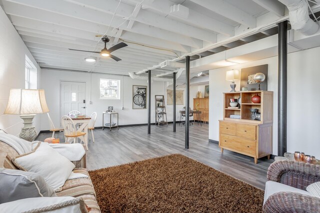 living room with ceiling fan, plenty of natural light, and hardwood / wood-style floors