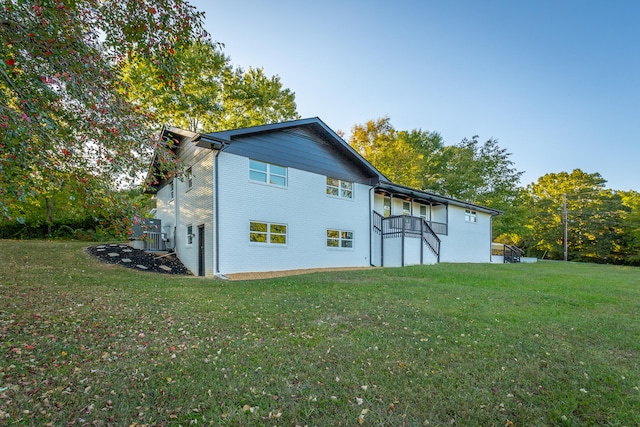 view of home's exterior featuring a lawn