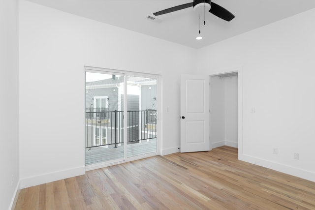 unfurnished room featuring light wood-type flooring and ceiling fan