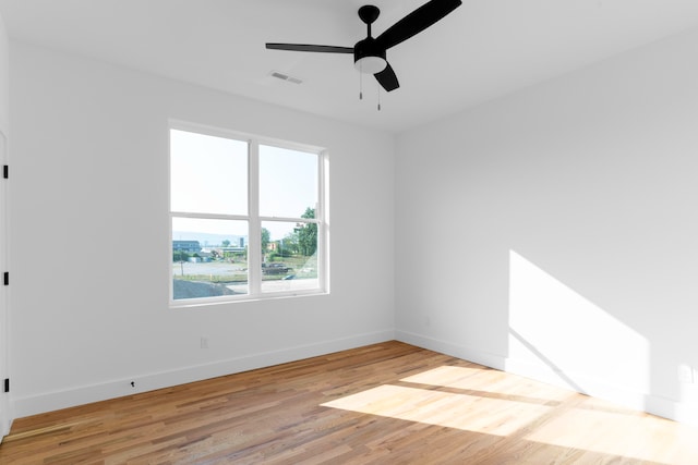 empty room with wood-type flooring and ceiling fan