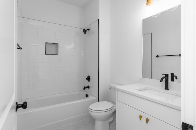 full bathroom featuring vanity, tiled shower / bath combo, toilet, and tile patterned floors