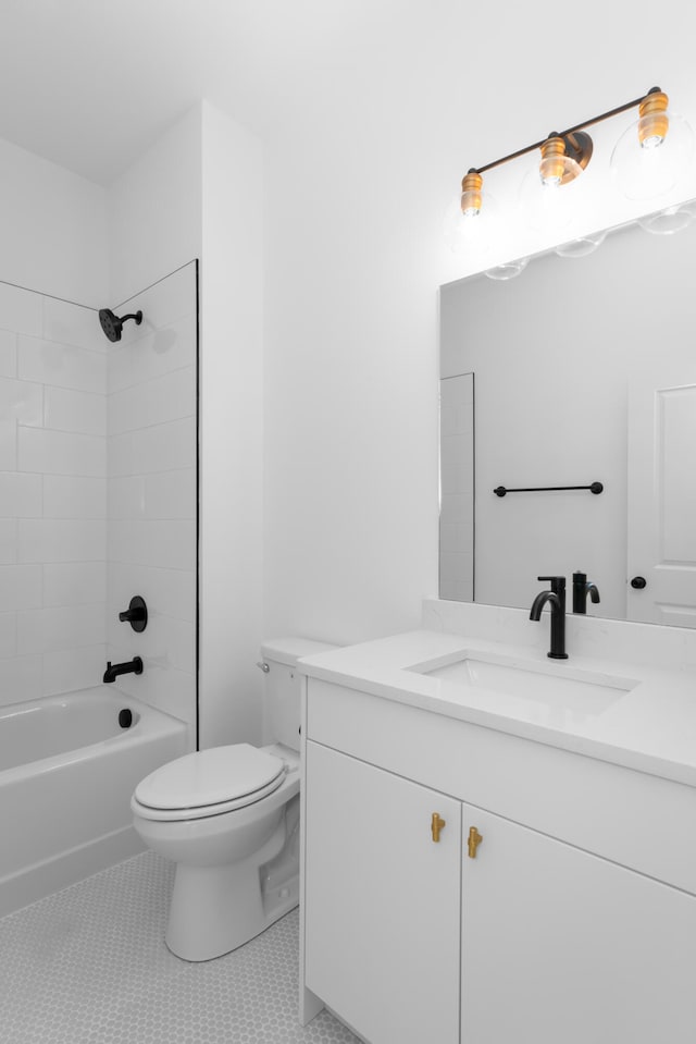 full bathroom with tiled shower / bath, vanity, toilet, and tile patterned floors