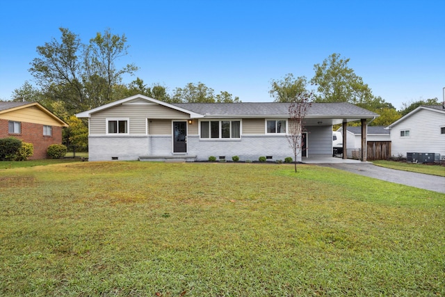 ranch-style house featuring a front lawn and a carport