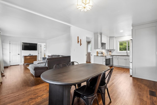 dining area with dark wood-type flooring